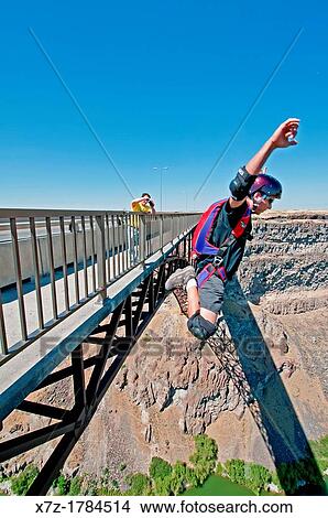 BASE Jumping the Perrine Memorial Bridge over the Snake River Canyon near the city of Twin Falls in southern Idaho View Large Photo Image Picture - BASE Jumping the Perrine Memorial Bridge over the Snake River Canyon near the city of Twin Falls in southern Idaho. Fotosearch