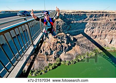 BASE Jumping the Perrine Memorial Bridge over the Snake River Canyon near the city of Twin Falls in southern Idaho. View Large Photo Image Picture - BASE Jumping the Perrine Memorial Bridge over the Snake River Canyon near the city of Twin Falls in southern Idaho.. Fotosearch
