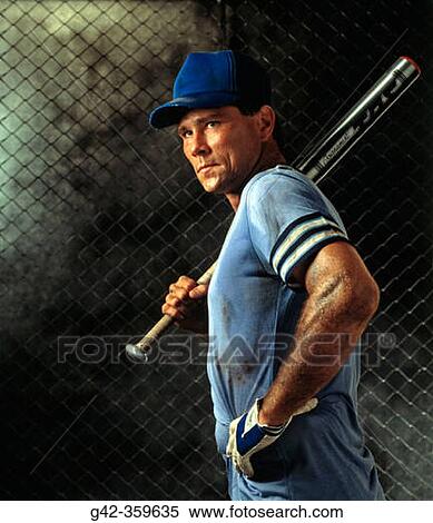 Stock Photography - Baseball batter shows determination as he steps to the plate.. Fotosearch