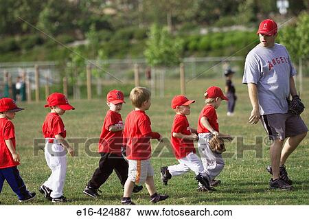 Baseball coach and young players View Large Photo Image Stock Photo - Baseball coach and young players. Fotosearch
