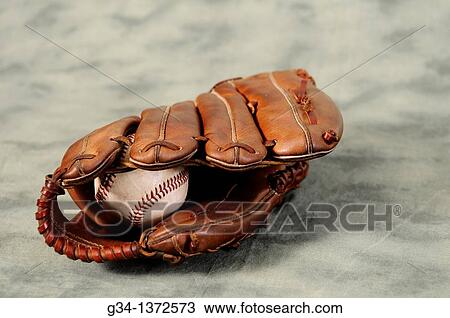 Stock Image - Baseball glove and ball. Fotosearch