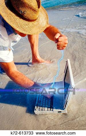 Stock Image - Bashing Laptop. Fotosearch