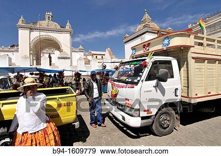 Basilica of Our Lady of Copacabana. Blessing of cars. Copacabana is the main Bolivian town on the shore of Lake Titicaca. Our Lady of Copacabana is the patron saint of Bolivia. Bolivia. View Large Photo Image Stock Photo - Basilica of Our Lady of Copacabana. Blessing of cars. Copacabana is the main Bolivian town on the shore of Lake Titicaca. Our Lady of Copacabana is the patron saint of Bolivia. Bolivia.. Fotosearch