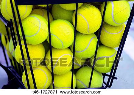 Stock Image - BASKET OF BALLS OF TENNIS. Fotosearch