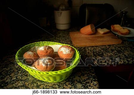 Stock Image - Basket of muffins. Fotosearch