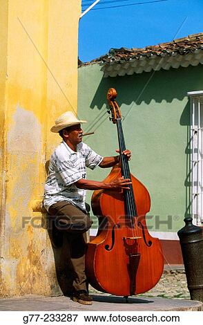 Bass player in a street of Trinidad de Cuba. Cuba View Large Photo Image Stock Photo - Bass player in a street of Trinidad de Cuba. Cuba. Fotosearch
