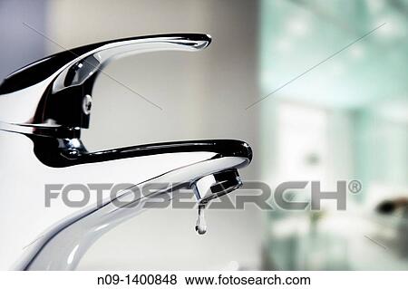 bathroom faucet leaking one drop View Large Photo Image Stock Photo - bathroom faucet leaking one drop. Fotosearch