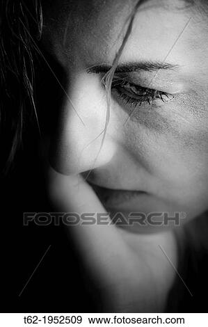 Stock Photo - Battered woman crying.. Fotosearch