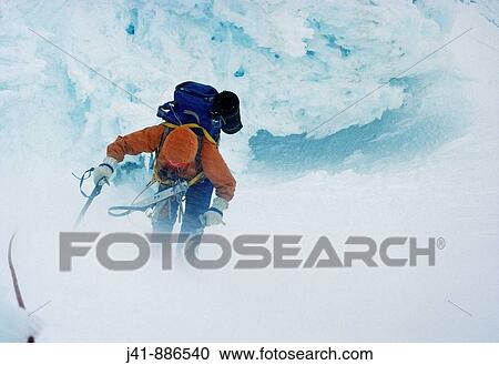 Battling against the wind climber near the top on the East Face of Sefton Mount Cook National Park New Zealand View Large Photo Image Stock Image - Battling against the wind climber near the top on the East Face of Sefton Mount Cook National Park New Zealand. Fotosearch