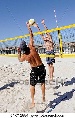Picture - Beach 2 on 2 volleyball played at The Pier Beach Naples Florida. Fotosearch