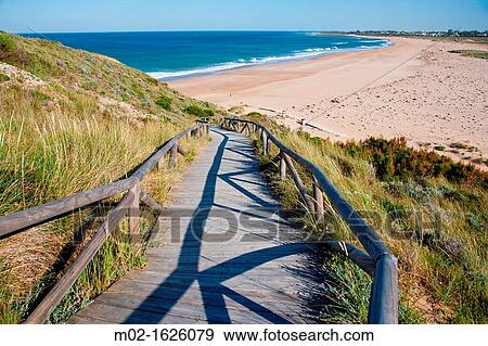 Stock Photo - Beach around Trafalgar lighthouse in Cadiz, Spain. Fotosearch