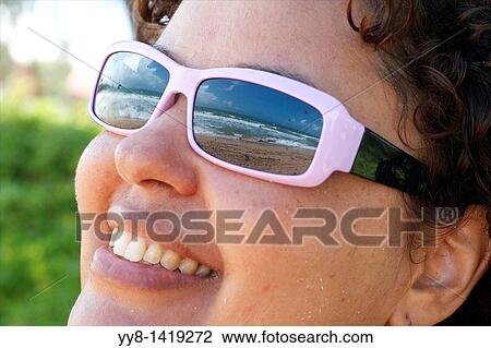 Stock Image - Beach at Humacao, Puerto Rico reflecting in sun glasses. Fotosearch