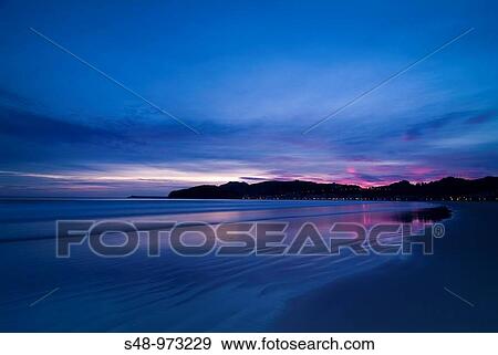 Beach at sunrise, Laredo. Cantabria, Spain View Large Photo Image Stock Photo - Beach at sunrise, Laredo. Cantabria, Spain. Fotosearch