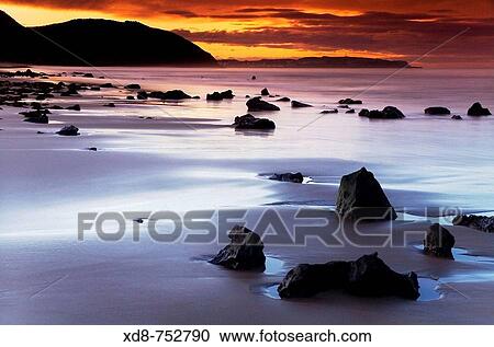 Beach at sunset, Berria beach, Santoa, Cantabria, Spain View Large Photo Image Stock Image - Beach at sunset, Berria beach, Santoa, Cantabria, Spain. Fotosearch