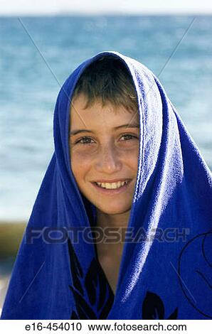 Beach boy with towel View Large Photo Image Stock Image - Beach boy with towel. Fotosearch