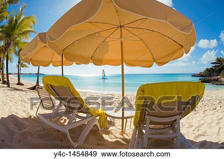 Beach chairs and umbellas on Meads Bay Beach on the caribbean island of Anguilla in the British West Indies View Large Photo Image Stock Photo - Beach chairs and umbellas on Meads Bay Beach on the caribbean island of Anguilla in the British West Indies. Fotosearch