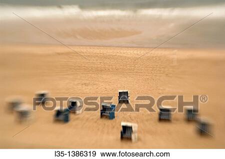 Stock Photo - Beach chairs on the beach of Sylt, look like toys. Fotosearch