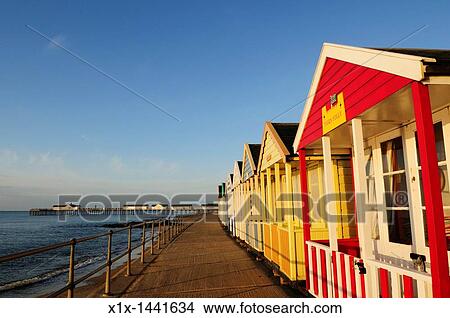 Beach Huts and Pier at Southwold, Suffolk, England, UK View Large Photo Image Picture - Beach Huts and Pier at Southwold, Suffolk, England, UK. Fotosearch