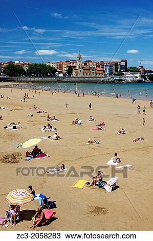 Beach of San Lorenzo with umbrellas and San Pedro Church, city of Gijon, Asturias, Spain. View Large Photo Image Stock Image - Beach of San Lorenzo with umbrellas and San Pedro Church, city of Gijon, Asturias, Spain.. Fotosearch