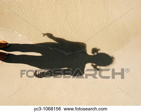 Stock Photograph - Beach shadow. Fotosearch