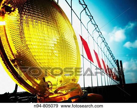 Stock Photo - Beacon warning road works cut in access to industrial source of the City of Jarro Paterna, Valencia. Spain. Europe.. Fotosearch