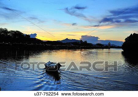 Beatifuf susnset at Kuching Water Front. View Large Photo Image Picture - Beatifuf susnset at Kuching Water Front.. Fotosearch
