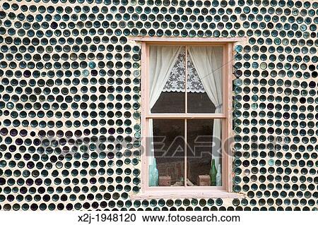 Beatty, Nevada - The bottle house in Rhyolite, a town that boomed for a few years after gold was discovered in 1904. Tom Kelly built the house in 1906 from thousands of discarded beer and liquor bottles. It was repaired in 1925 and 2005. View Large Photo Image Stock Image - Beatty, Nevada - The bottle house in Rhyolite, a town that boomed for a few years after gold was discovered in 1904. Tom Kelly built the house in 1906 from thousands of discarded beer and liquor bottles. It was repaired in 1925 and 2005.. Fotosearch