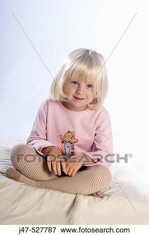 beautiful 3 year old girl with blonde hair sitting on the floor, smiling off camera, in the studio View Large Photo Image Stock Photo - beautiful 3 year old girl with blonde hair sitting on the floor, smiling off camera, in the studio. Fotosearch