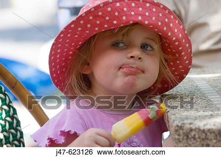 beautiful 3 year old girl with huge blue eyes, licking a bit of lolly off her lip View Large Photo Image Stock Photograph - beautiful 3 year old girl with huge blue eyes, licking a bit of lolly off her lip. Fotosearch