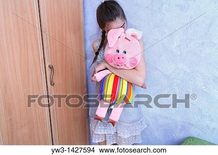Beautiful Blond girl with her Plush Pig View Large Photo Image Picture - Beautiful Blond girl with her Plush Pig. Fotosearch