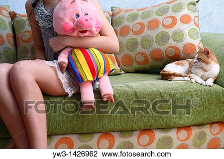 Beautiful Blond girl with her Plush Pig View Large Photo Image Stock Image - Beautiful Blond girl with her Plush Pig. Fotosearch