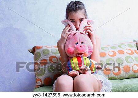 Beautiful Blond girl with her Plush Pig View Large Photo Image Stock Photograph - Beautiful Blond girl with her Plush Pig. Fotosearch