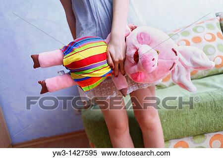 Beautiful Blond girl with her Plush Pig View Large Photo Image Stock Photography - Beautiful Blond girl with her Plush Pig. Fotosearch