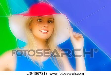 Beautiful blonde attractive woman in red hat and under colorful umbrella outdoors View Large Photo Image Stock Image - Beautiful blonde attractive woman in red hat and under colorful umbrella outdoors. Fotosearch