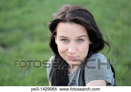 beautiful brunette outdoor portrait on grass View Large Photo Image Stock Photography - beautiful brunette outdoor portrait on grass. Fotosearch