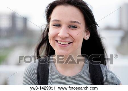Stock Image - beautiful brunette outdoor portrait. Fotosearch