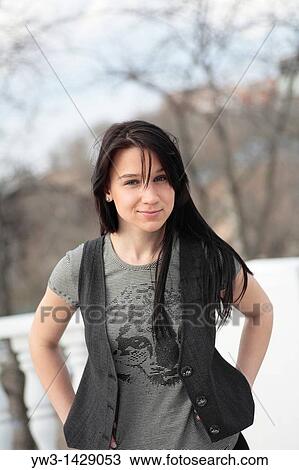 Stock Image - beautiful brunette outdoor portrait. Fotosearch