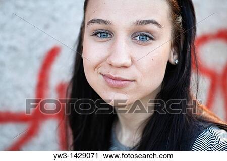 beautiful brunette outdoor portrait against street graffiti View Large Photo Image Stock Image - beautiful brunette outdoor portrait against street graffiti. Fotosearch