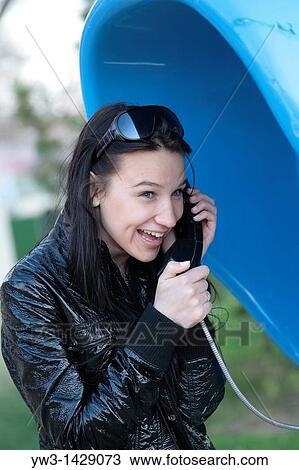 beautiful brunette outdoor portrait calling by street phone View Large Photo Image Stock Image - beautiful brunette outdoor portrait calling by street phone. Fotosearch