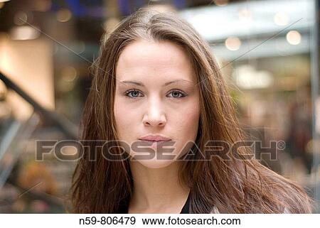 Beautiful brunette woman in urban setting View Large Photo Image Stock Photo - Beautiful brunette woman in urban setting. Fotosearch