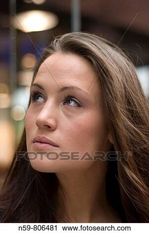 Beautiful brunette woman looking upwards View Large Photo Image Stock Image - Beautiful brunette woman looking upwards. Fotosearch