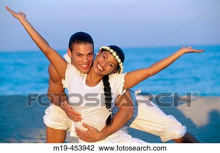 beautiful couple in white on the beach View Large Photo Image Stock Image - beautiful couple in white on the beach. Fotosearch