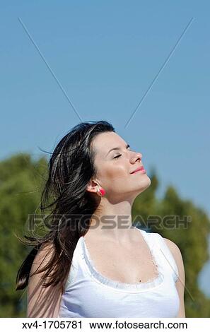Beautiful girl enjoy in the meadow View Large Photo Image Stock Image - Beautiful girl enjoy in the meadow. Fotosearch