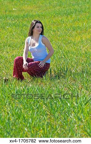 Beautiful girl enjoy in the meadow View Large Photo Image Stock Image - Beautiful girl enjoy in the meadow. Fotosearch