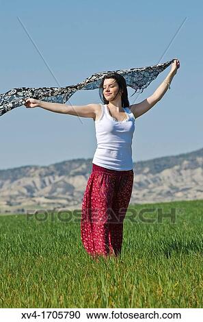 Beautiful girl enjoy in the meadow View Large Photo Image Stock Image - Beautiful girl enjoy in the meadow. Fotosearch