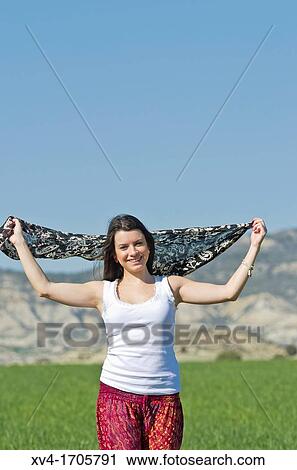 Beautiful girl enjoy in the meadow View Large Photo Image Stock Image - Beautiful girl enjoy in the meadow. Fotosearch