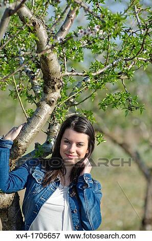 Beautiful girl looking at camera in countryside View Large Photo Image Stock Photo - Beautiful girl looking at camera in countryside. Fotosearch