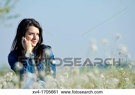 Beautiful girl relaxing in countryside View Large Photo Image Stock Image - Beautiful girl relaxing in countryside. Fotosearch