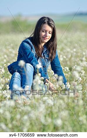 Beautiful girl relaxing in countryside View Large Photo Image Stock Photo - Beautiful girl relaxing in countryside. Fotosearch