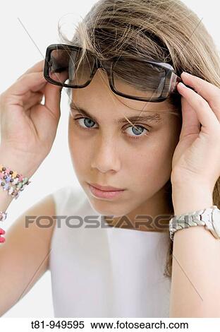 beautiful, girl, seriously, a woman, cover, goggles, sunglasses, face, portrait, pretty, sexy, eyes, eyes, blue eyes, discovering, watching, face, fence, groomed, dressed, prepared, modern look, looking at camera, front, looking pretty View Large Photo Image Stock Photography - beautiful, girl, seriously, a woman, cover, goggles, sunglasses, face, portrait, pretty, sexy, eyes, eyes, blue eyes, discovering, watching, face, fence, groomed, dressed, prepared, modern look, looking at camera, front, looking pretty. Fotosearch